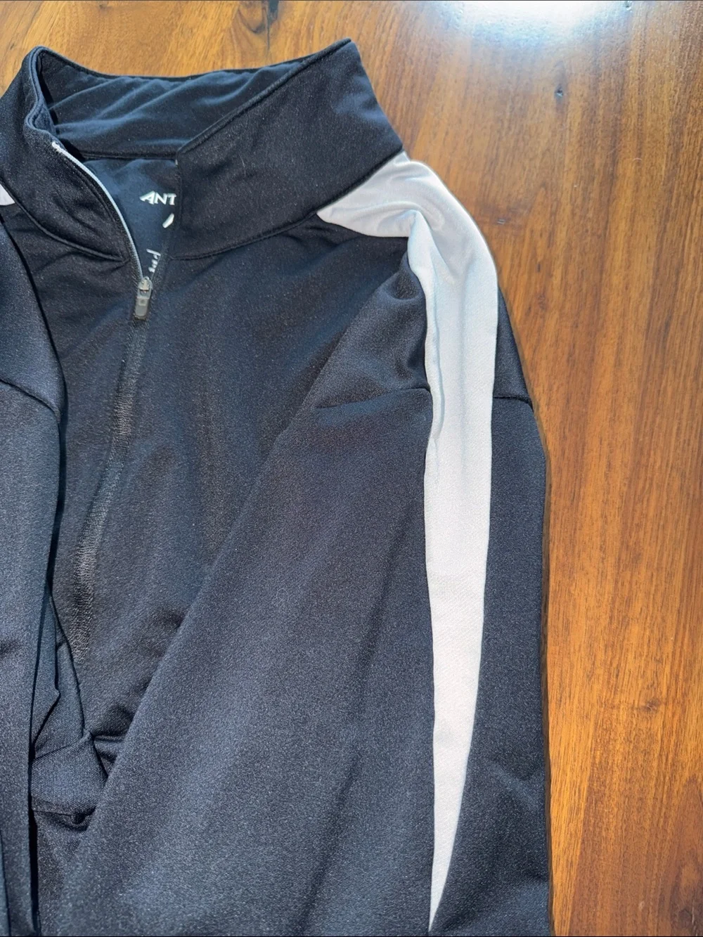Antigua Black Quarter-Zip Pullover with Gray Shoulder Accents and Team Crest